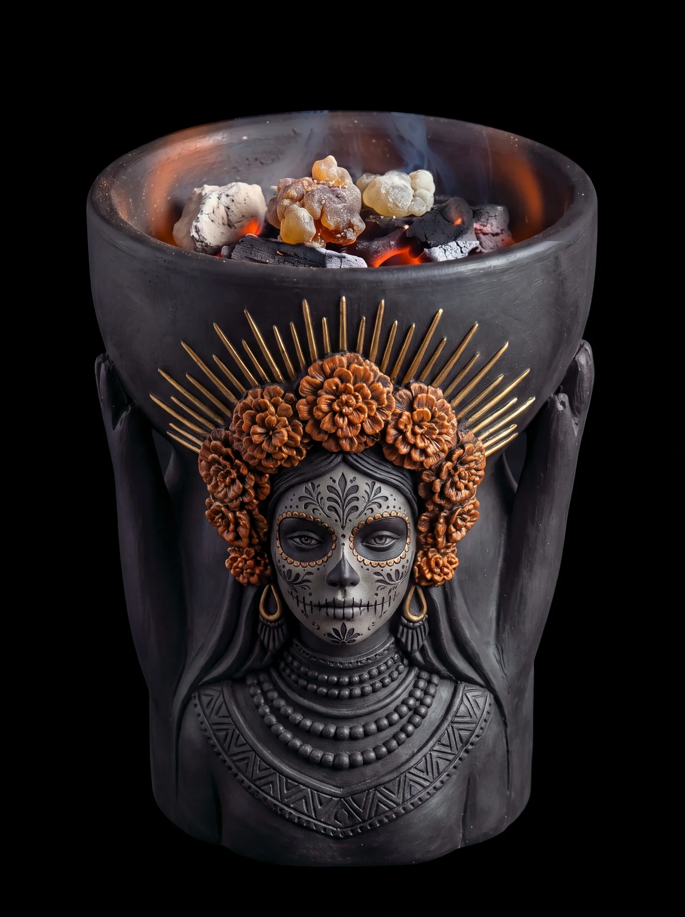 A black clay copal burner shaped as a woman in calavera paint, crowned with marigolds and golden rays. Her raised hands hold the bowl, where copal glows on the embers and smoke rises.